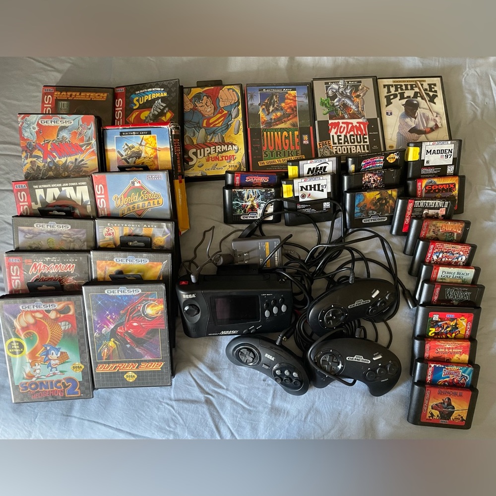 Genesis Nomad gaming console set w/lot of cartridges+free gaming accessories.
